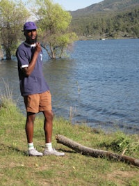 a man standing near a body of water